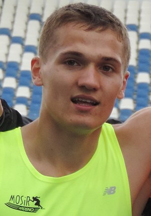 Marcin Kuliga z dwoma kółkami olimpijskimi - zdjęcie w treści  nr 1