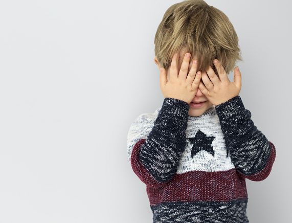 Freepik. little boy hands hidden face